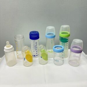 9 bottles 4 8oz playtex drop ins, 2 4oz playtex drop in, 1 gerber 2 evenfo comfi